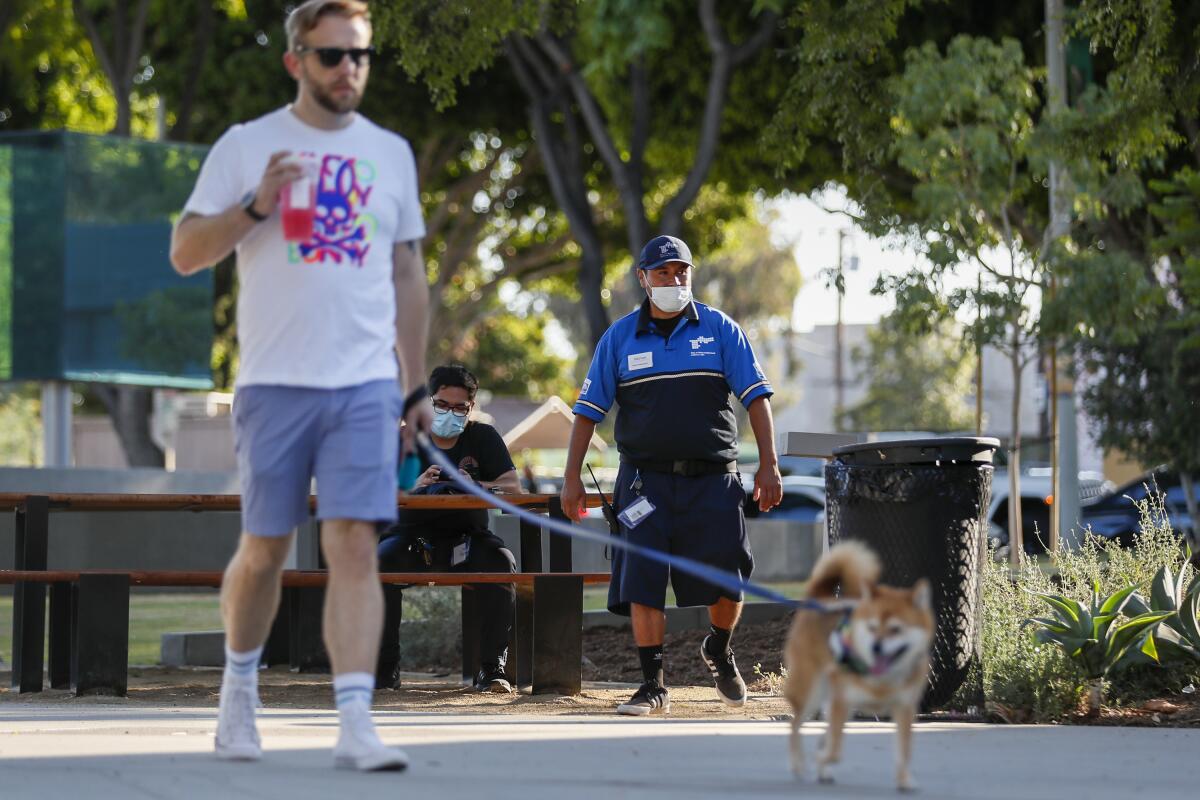 A West Hollywood security ambassador patrols West Hollywood Park. 