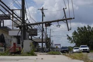 Traffic is directed around a downed power line in Houston, Tuesday, July 9, 2024. After Hurricane Beryl slammed into Texas, knocking out power to nearly 3 million homes and businesses it moved east and weakened to a tropical depression. (AP Photo/Eric Gay)