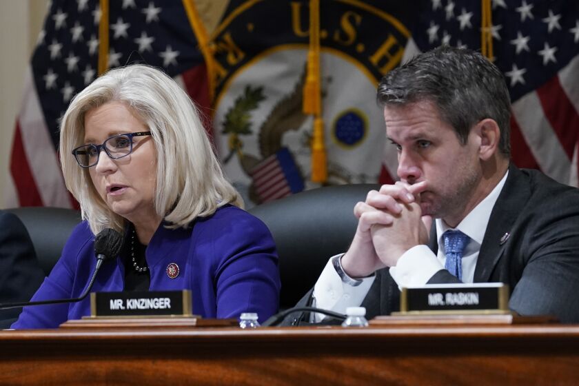 Rep. Liz Cheney, R-Wyo., and Rep. Adam Kinzinger, R-Ill., listen as the House select committee tasked with investigating the Jan. 6 attack on the U.S. Capitol meets to hold Steve Bannon, one of former President Donald Trump's allies in contempt, on Capitol Hill in Washington, Tuesday, Oct. 19, 2021. (AP Photo/J. Scott Applewhite)