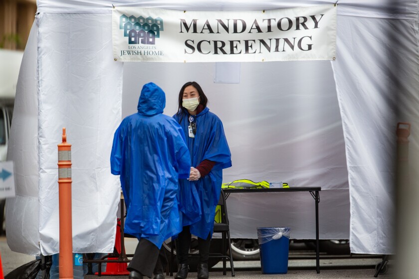 Medical workers in gowns and masks