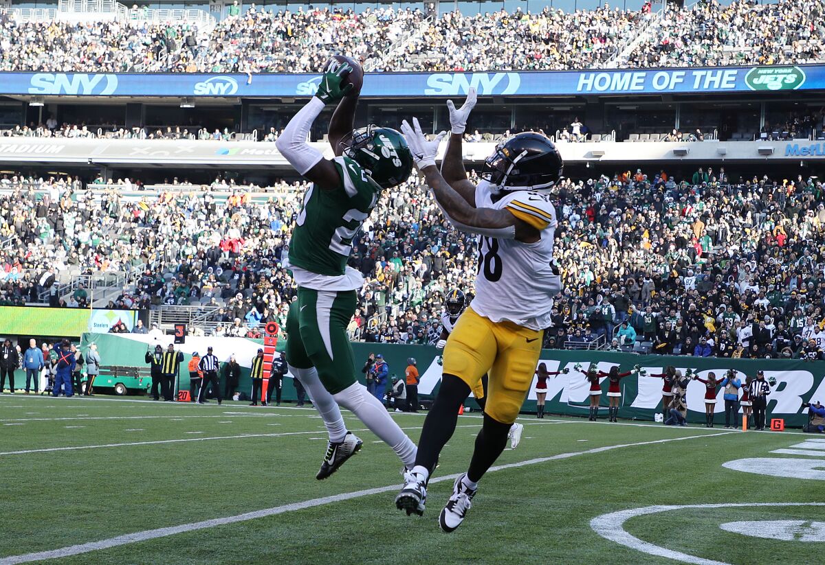 New York Jets safety Marcus Maye intercepts a pass in the end zone intended for Pittsburgh Steelers running back Jaylen Samuels.