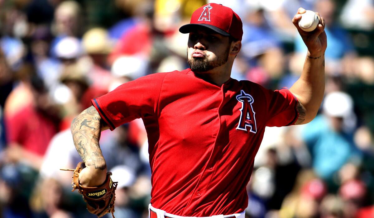 Angels starting pitcher Hector Santiago pitches during a spring training game against the Texas Rangers on Tuesday.