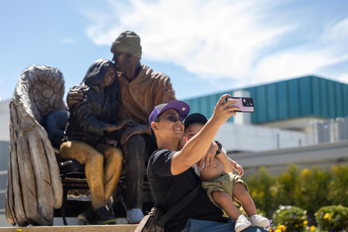 A father and son take a selfie