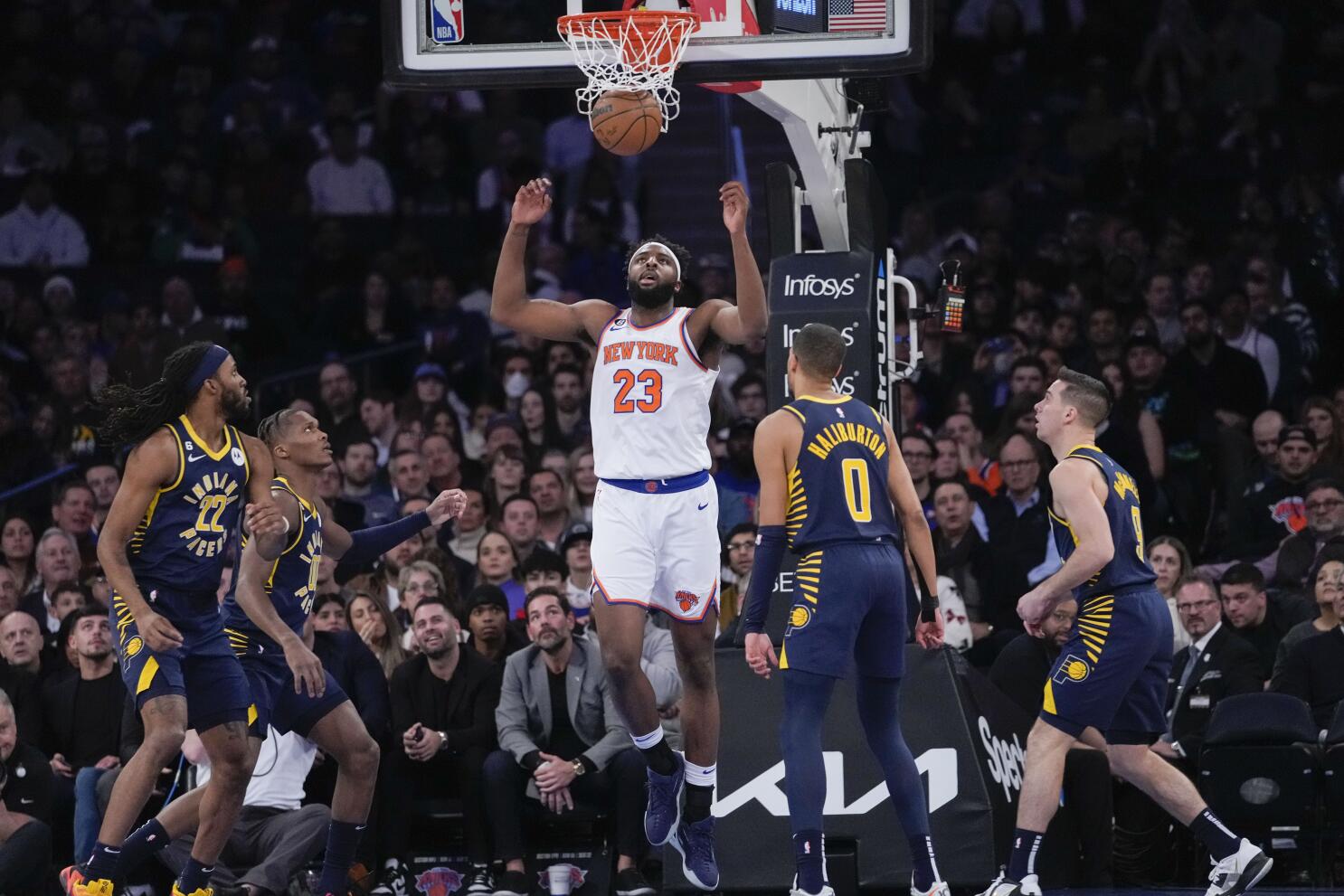 New York Knicks center Mitchell Robinson (23) rebounds against