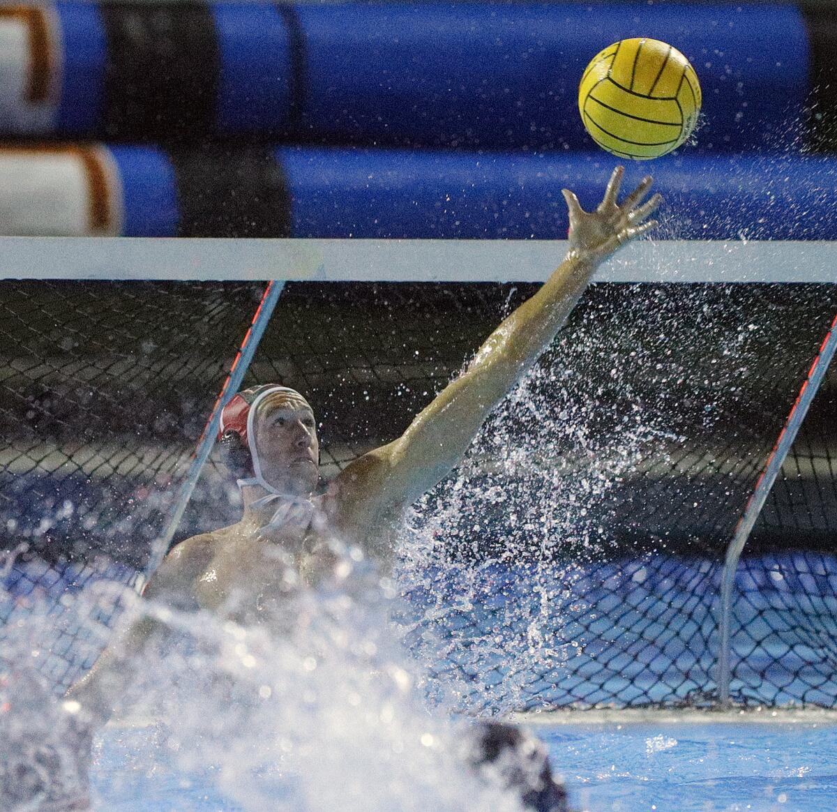 Huntington Beach goalkeeper Jacob Pyle makes a save against Harvard-Westlake in the CIF Southern Section Division 1 semifinal playoff match at Woollett Aquatics Center in Irvine on Wednesday.