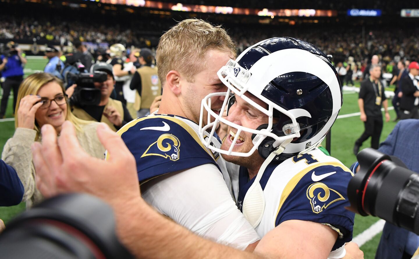 Rams quarterback Jared Goff hugs kicker Greg Zuerlein after defeating the New Orleans Saints in overtime on a field goal in the NFC Championship at the Superdome in New Orleans Sunday.