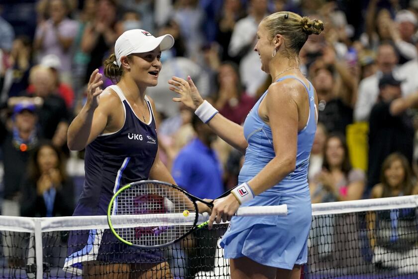 Shelby Rogers, right, greets Ashleigh Barty at the net after defeating Barty during the third round of the U.S. Open.