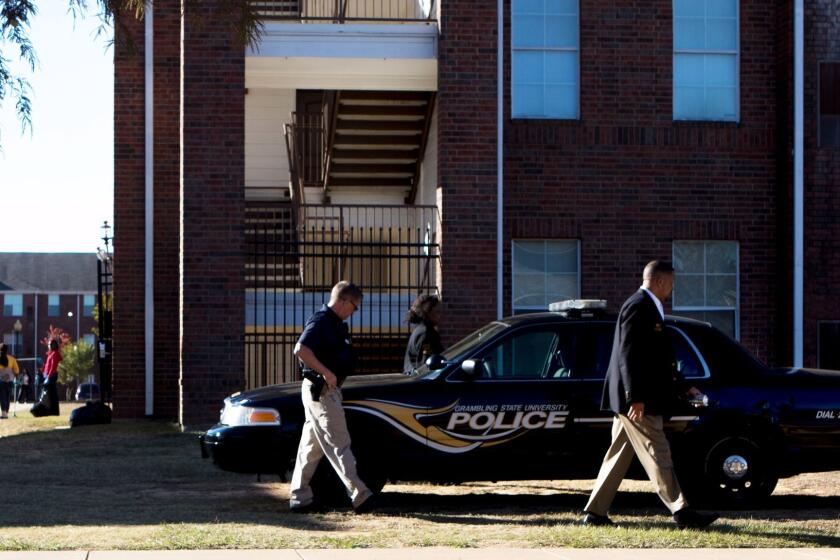 Grambling State University Police work the scene of a shooting in Grambling, La., Wednesday, Oct. 25, 2017. Authorities said a student and his friend were fatally shot after an altercation that began in a dorm room and ended in a courtyard at the historically black university in northern Louisiana. (Hannah Baldwin/The News-Star via AP)