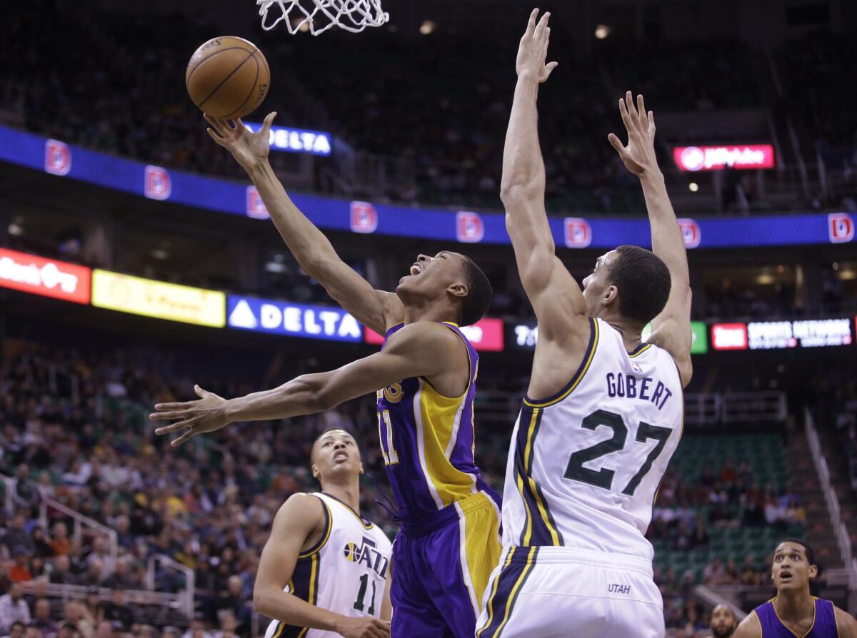 Wesley Johnson drives to the hoop against Utah center Rudy Gobert during the first quarter of a game Wednesday.