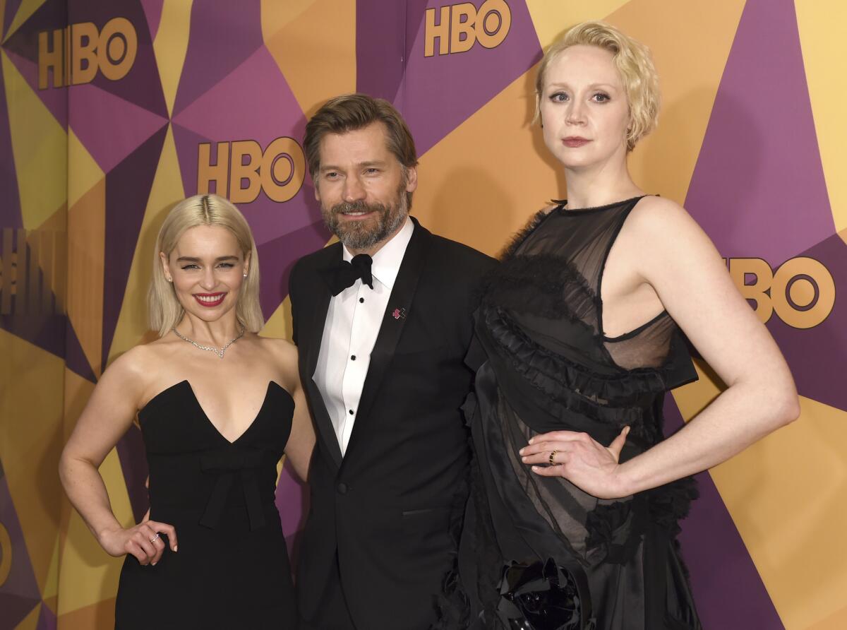 Emilia Clarke, left, Nikolaj Coster-Waldau and Gwendoline Christie arrive at the HBO Golden Globes after-party.
