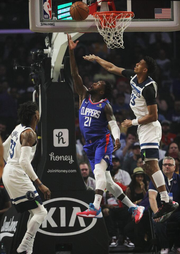 Clippers guard Patrick Beverley throws up a reverse layup during the first half of a game against the Timberwolves on Feb. 1 at Staples Center.