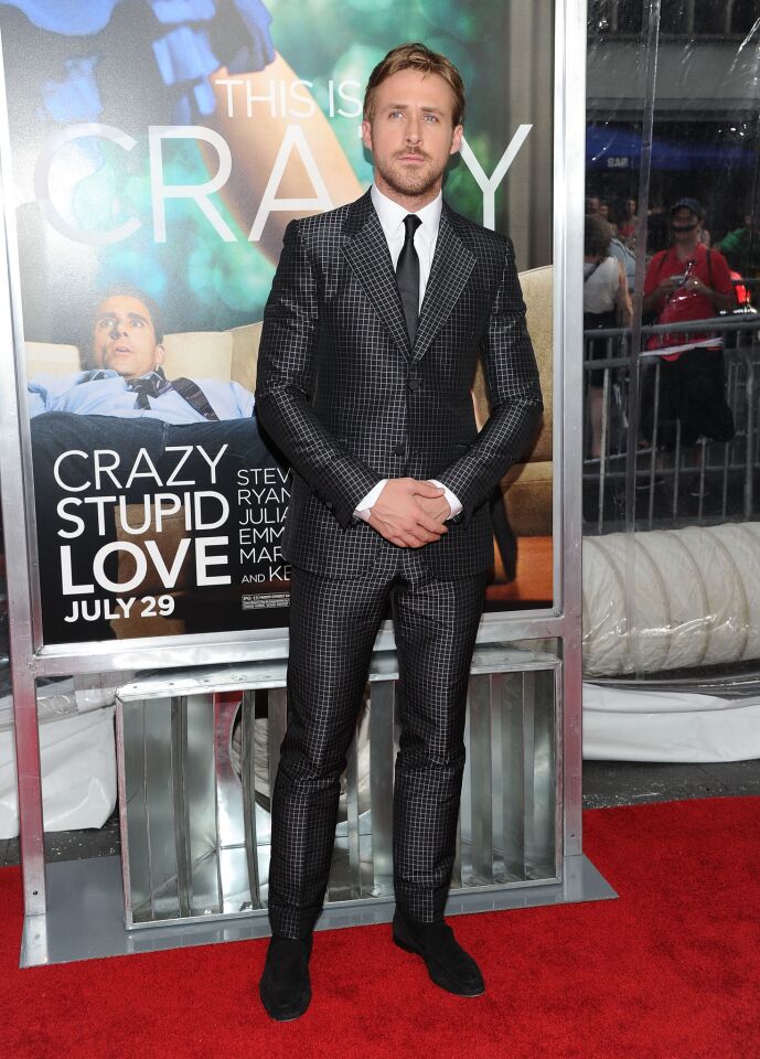 Ryan Gosling goes sleek in a Gucci small checkered suit with suede loafers.