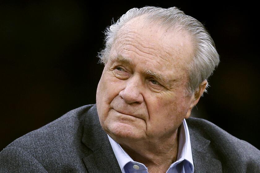 FILE - This Sept. 30, 2018, file photo shows former Boston Celtics great Tommy Heinsohn prior to a preseason basketball game in Boston. Tommy Heinsohn, who as a Boston Celtics player, coach and broadcaster was with the team for all 17 of its NBA championships, has died. He was 86. The team confirmed Heinsohn's death on Tuesday, Nov. 10, 2020. (AP Photo/Charles Krupa, File)
