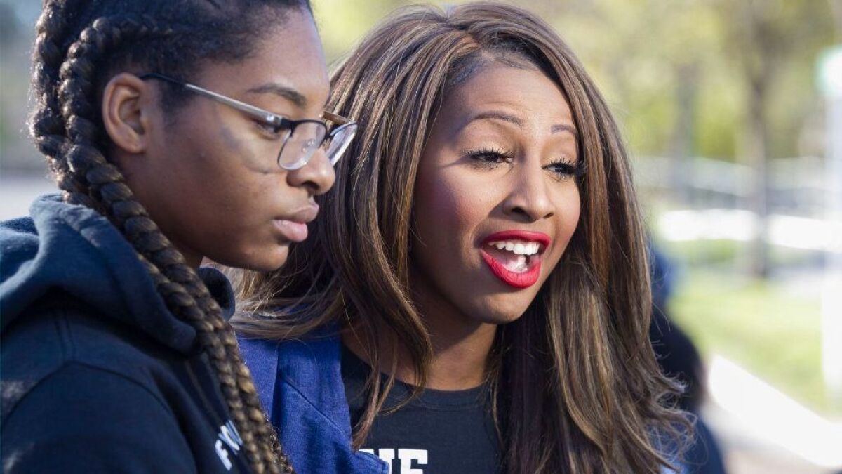 Social-justice activist Aeiramique Glass Blake, right, says a political consulting firm told her it could not work for her congressional campaign because of an edict by the Democratic Congressional Campaign Committee.