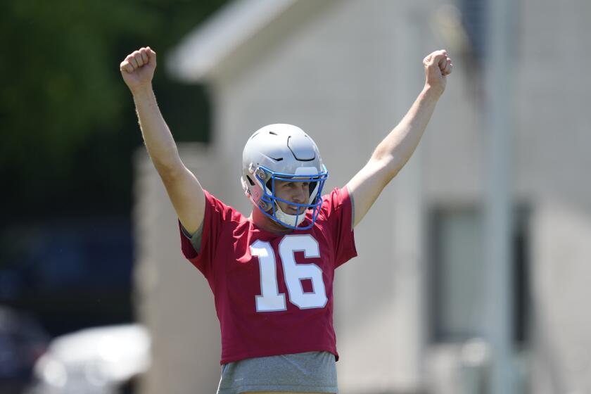 Detroit Lions quarterback Jared Goff reacts after a play during an NFL football practice, Thursday, May 30, 2024, in Allen Park, Mich. (AP Photo/Carlos Osorio)