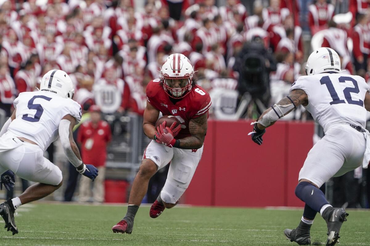 Wisconsin's Chez Mellusi runs during the second half of an NCAA college football game against Penn State Saturday, Sept. 4, 2021, in Madison, Wis. Penn State won 16-10. (AP Photo/Morry Gash)