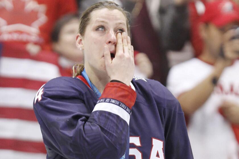 Angela Ruggiero wipes tears after winning a silver medal with the U.S. hockey team at the 2010 Vancouver Winter Olympics.