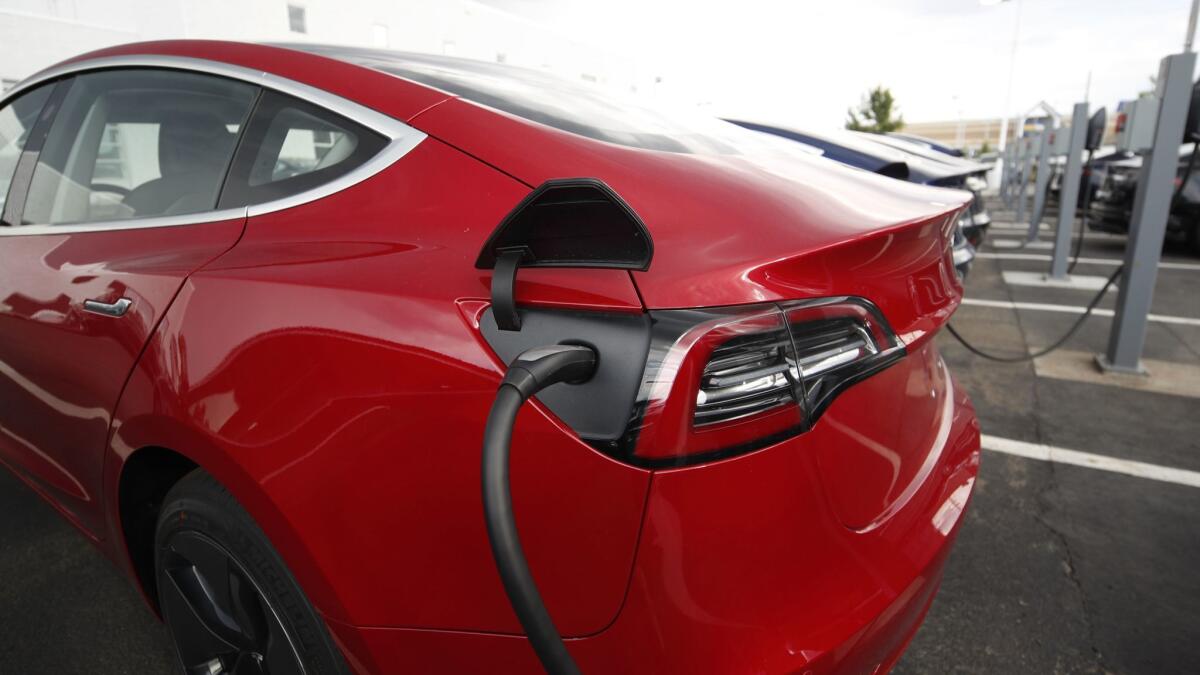 A Tesla Model 3 powers up in Littleton, Colo.