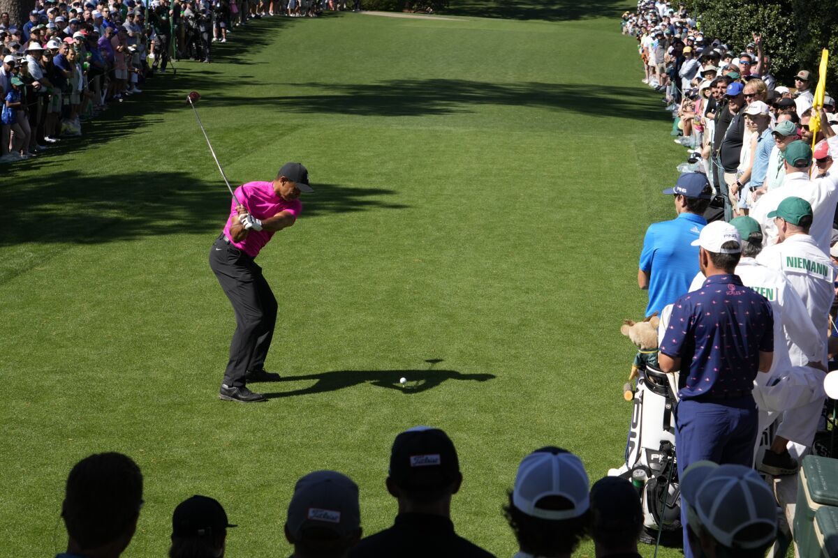Tiger Woods tees off on the 18th hole during the first round of the Masters on Thursday.