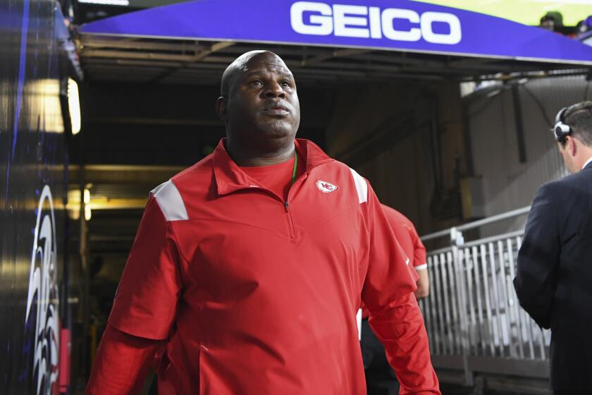 Kansas City Chiefs offensive coordinator Eric Bieniemy walks out of the tunnel before a game against the Baltimore Ravens
