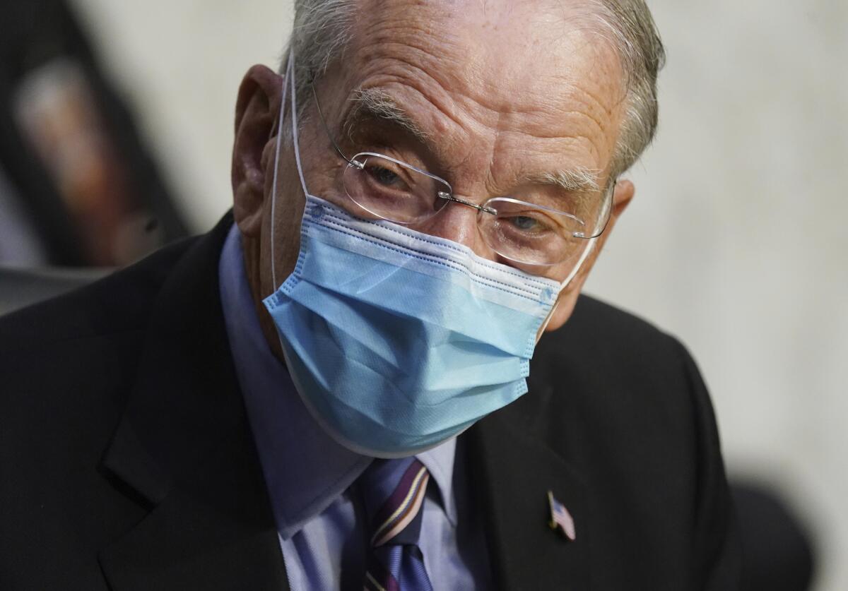 Sen. Charles E. Grassley wears a protective mask at a Supreme Court confirmation hearing for Amy Coney Barrett in October.