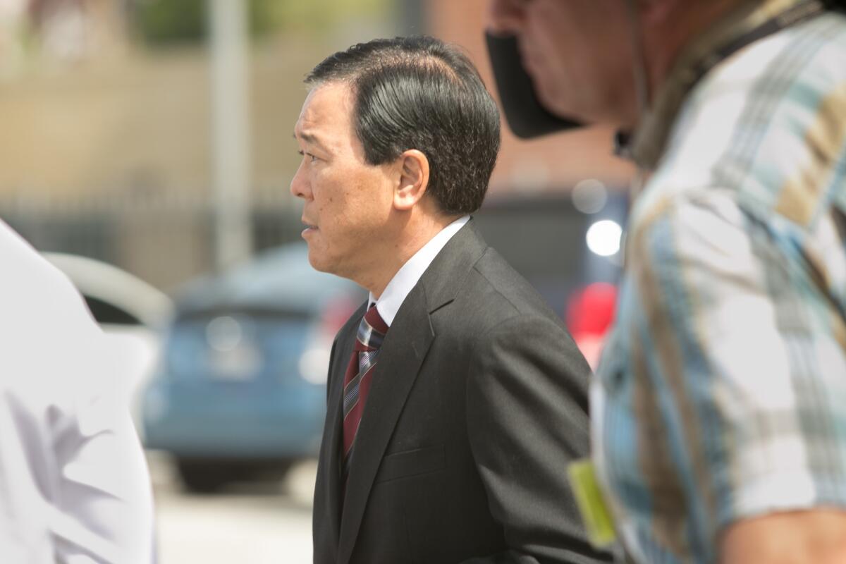 Former Los Angeles County Undersheriff Paul Tanaka leaves the downtown federal courthouse earlier this year after a jury convicted him on conspiracy and obstruction of justice charges.