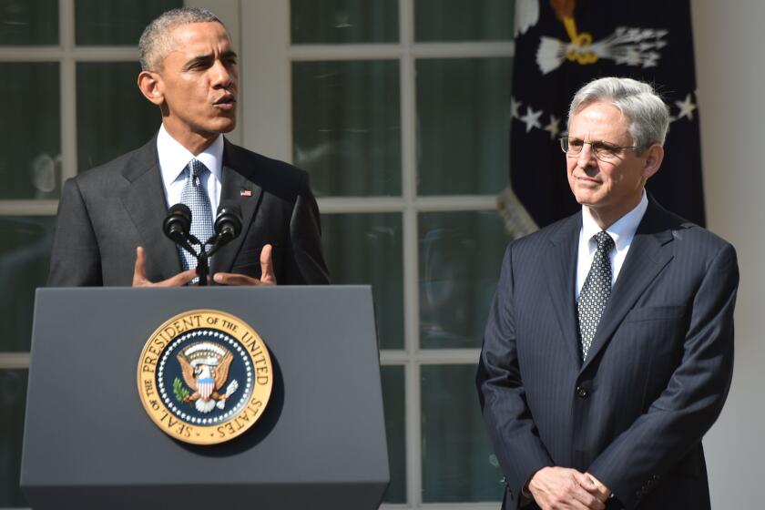 President Obama announces his Supreme Court nominee, Merrick Garland, right, in the Rose Garden at the White House on Wednesday.