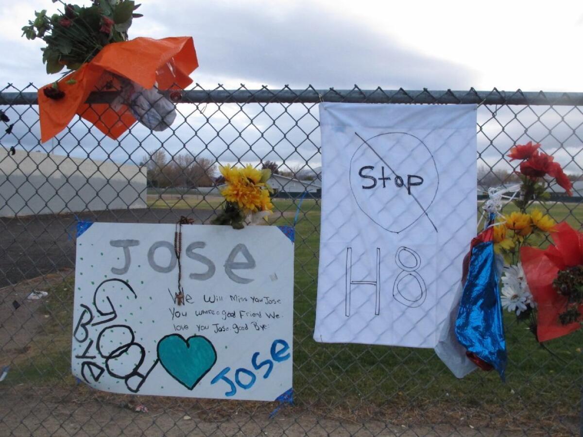 Friends have added a message to Jose Reyes and a small wooden cross at a memorial outside Sparks Middle School, where the seventh-grader fatally shot a teacher and wounded two 12-year-old classmates before killing himself in the schoolyard a week ago.