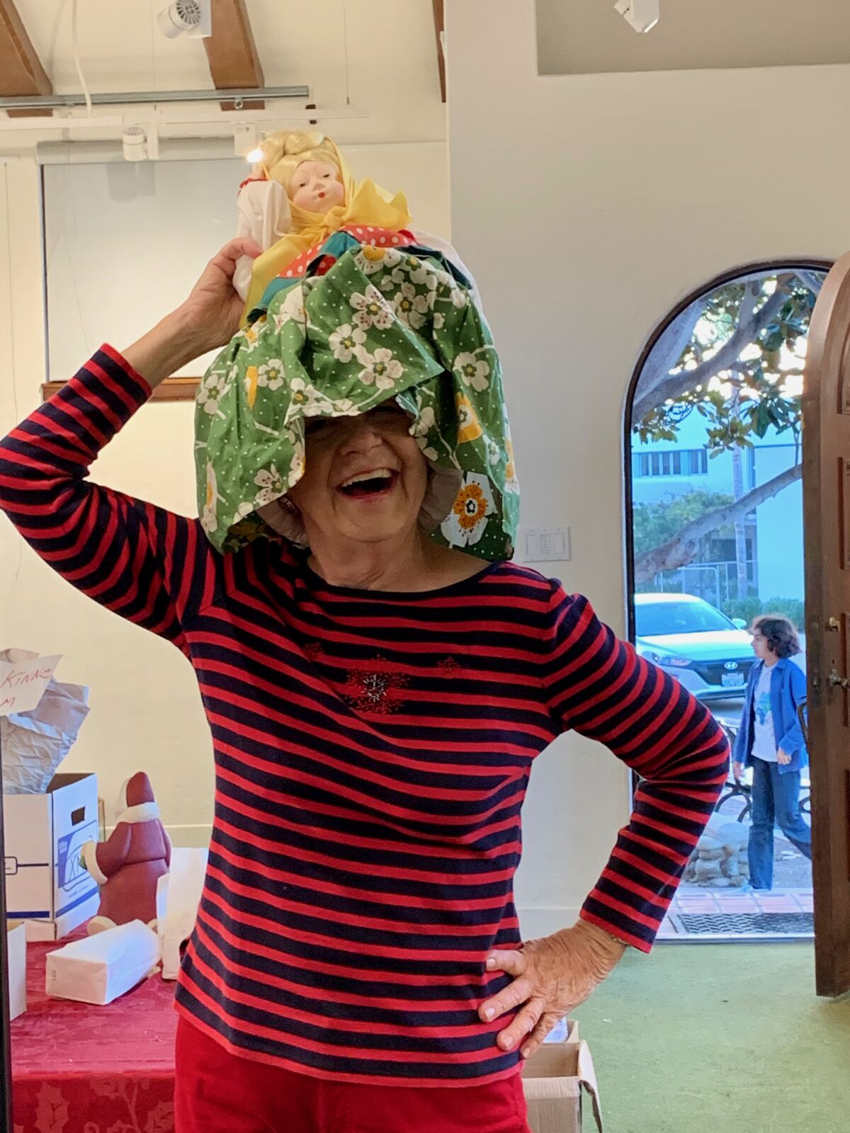 Sherry Seymour gets crazy with a cozy at St. James by-the-Sea Episcopal Church's Christmas Bazaar.