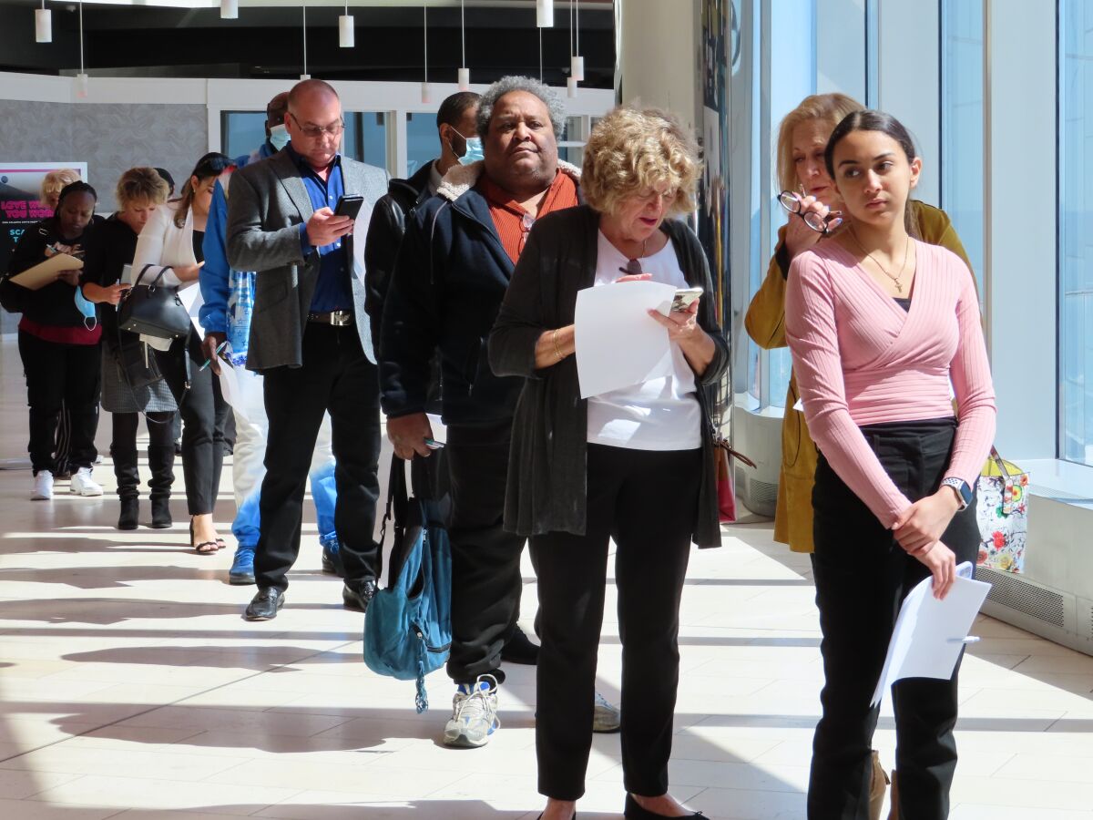 Applicants line up at a job fair at the Ocean Casino Resort in Atlantic City N.J. on April 11, 2022. Casinos across the country are trying to find additional workers as their businesses try to recover from the coronavirus pandemic, but are facing the same labor shortages as many other industries. (AP Photo/Wayne Parry)