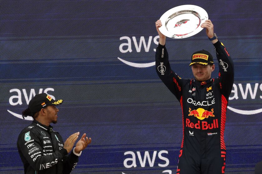 Lewis Hamilton applauds to winner Max Verstappen of the Netherlands after the Spanish Formula One Grand Prix.