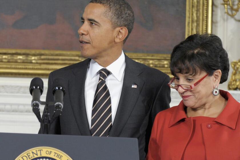 President Obama stands with Commerce Secretary nominee Penny Pritzker in the White House.