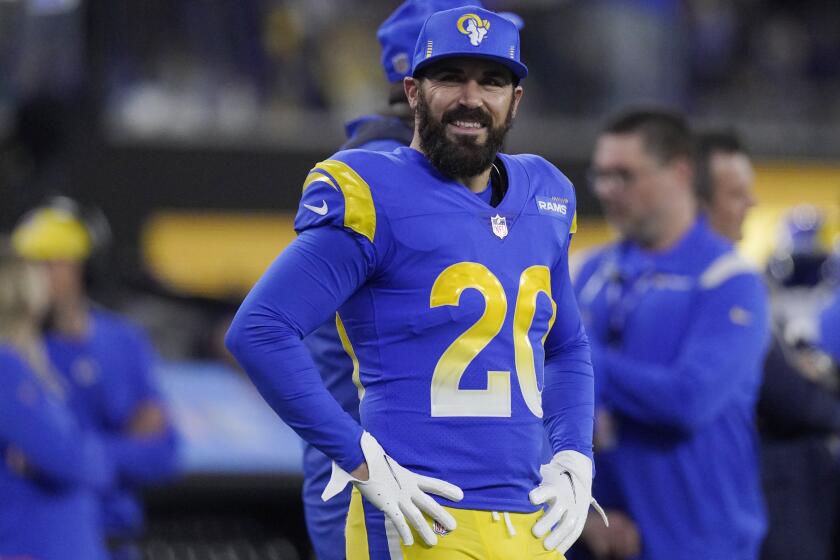 Los Angeles Rams defensive back Eric Weddle (20) watches from the sideline.