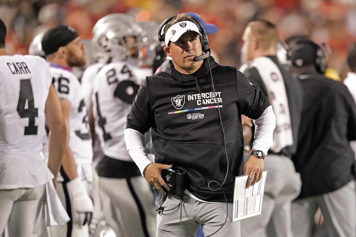 Las Vegas Raiders head coach Josh McDaniels watches during the second half of an NFL football game against the Kansas City Chiefs Monday, Oct. 10, 2022, in Kansas City, Mo. The Chiefs won 30-29. (AP Photo/Charlie Riedel)