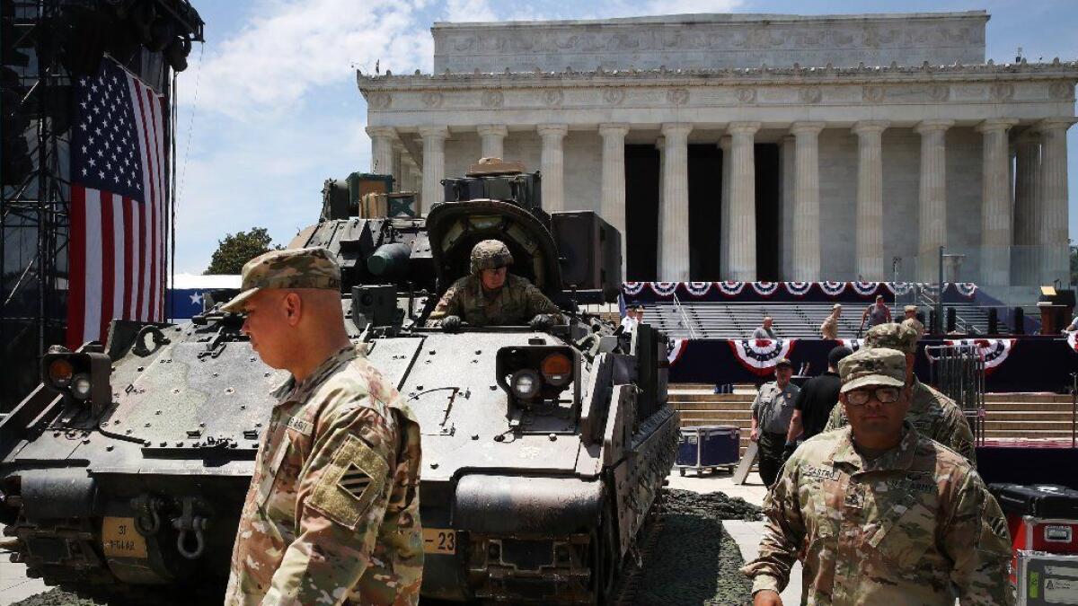 U.S. Army personnel on July 3 finish parking tanks in front of the Lincoln Memorial in preparation for the Fourth of July "Salute to America" celebration in Washington.