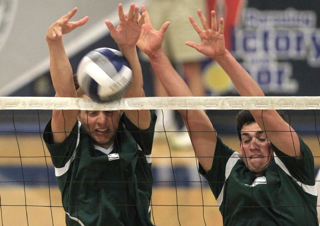 Edison High's Will Donald, left, and teammate Jack Dorman defend at the net against Newport Harbor during a Sunset League match on Tuesday.