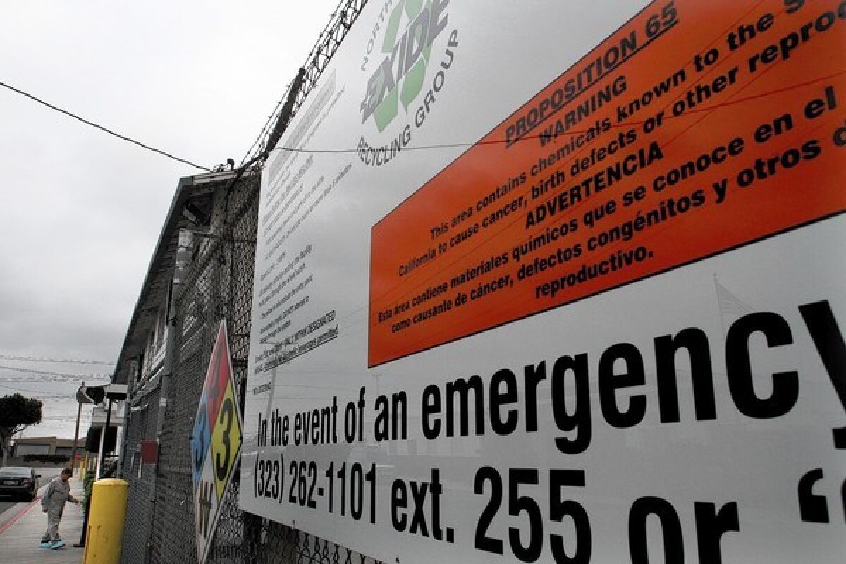 A warning sign is posted outside Exide's plant in Vernon.