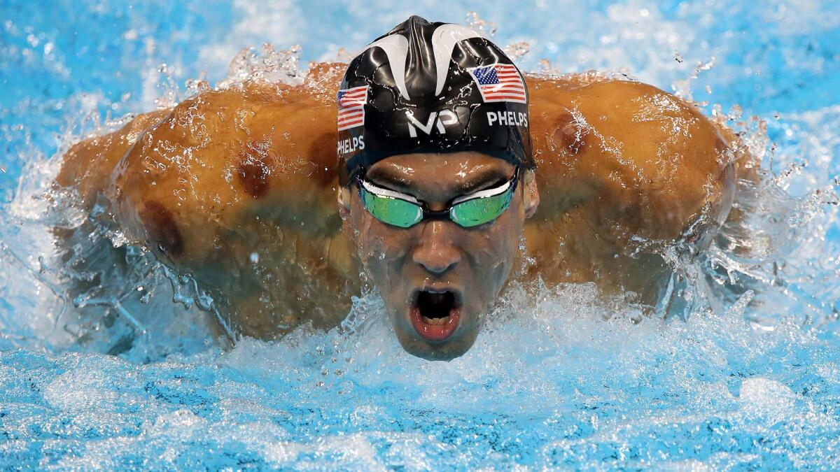 Michael Phelps swims to another gold medal in the men's 200-meter butterfly on Tuesday.
