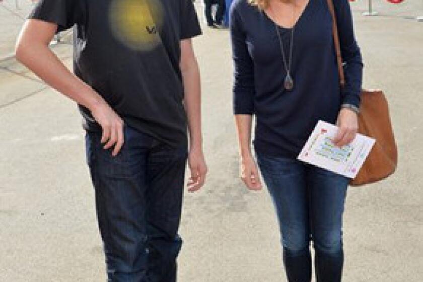 Actress Lisa Kudrow and son Julian Murray Stern attend the P.S. Arts "Express Yourself 2013" event at Barker Hangar on Sunday.