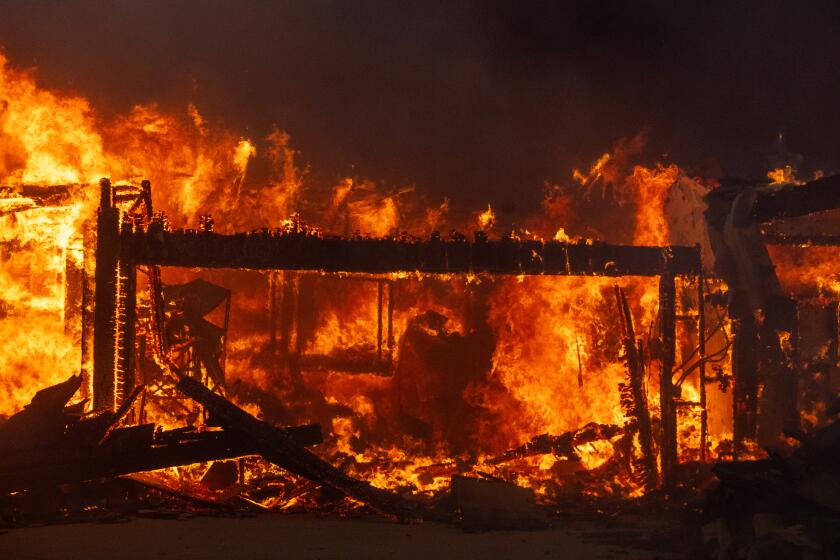 Pacific Palisades, CA - January 07: The Palisades fire destroys a home on El Medio Ave. on Tuesday, Jan. 7, 2025 in Pacific Palisades, CA. (Brian van der Brug / Los Angeles Times)