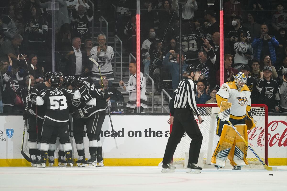 The Kings celebrate after a goal by center Adrian Kempe.
