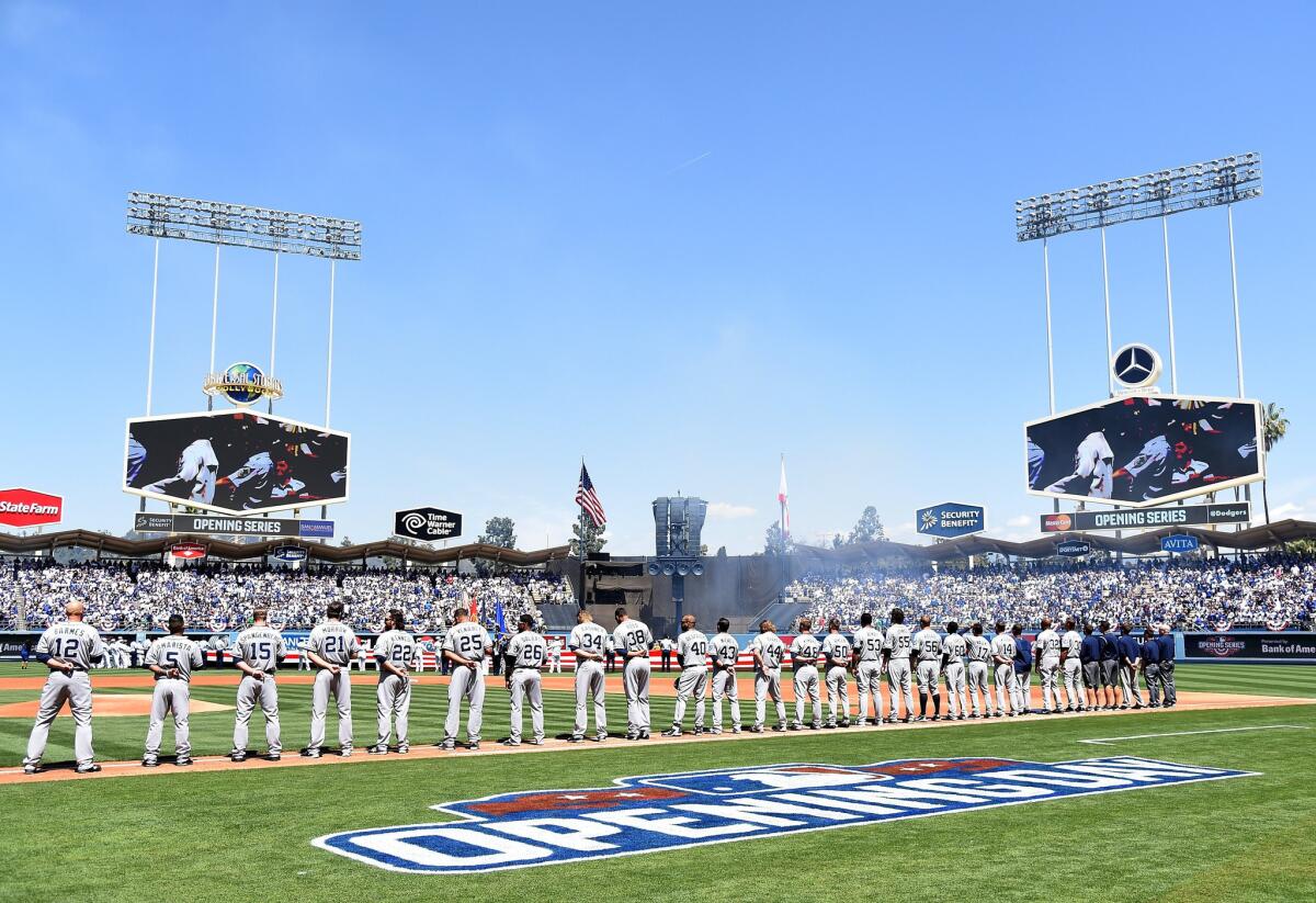 The San Diego Padres line up during introductions before opening day at Dodger Stadium on April 6.
