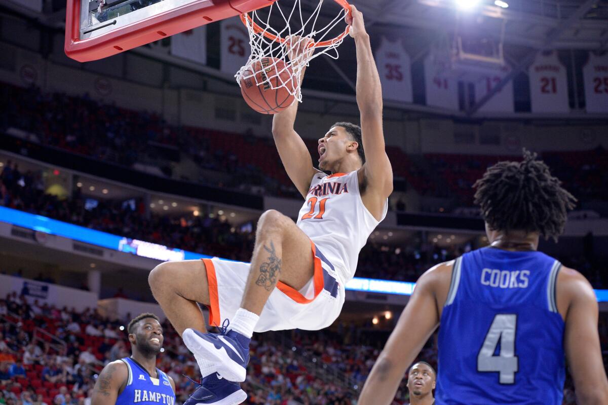 Virginia's Isaiah Wilkins dunks the ball against Hampton.