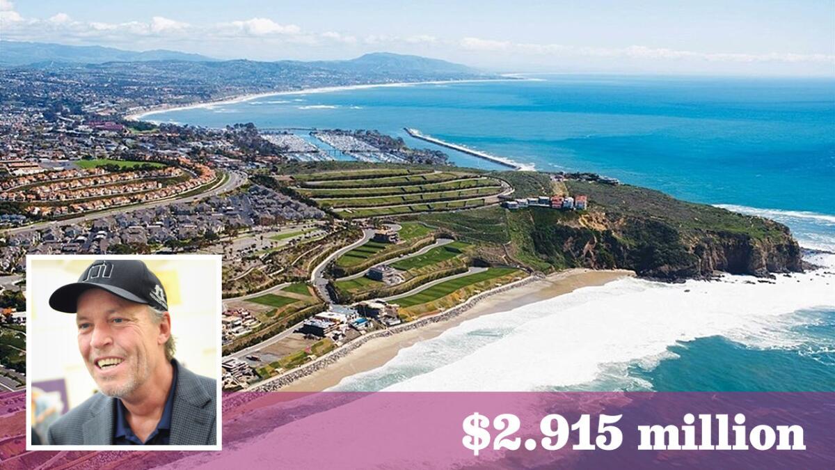Lakers co-owner Jim Buss has paid $2.915 million for a quarter-acre lot in a Dana Point development.