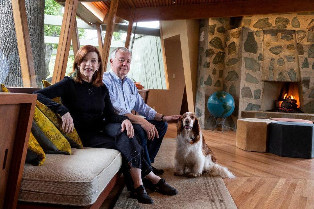 Susan Orlean, John Gillespie and Ivy, their Welsh springer spaniel. “We don’t plan to move again,” Orlean says. “You can bury me in the courtyard.”