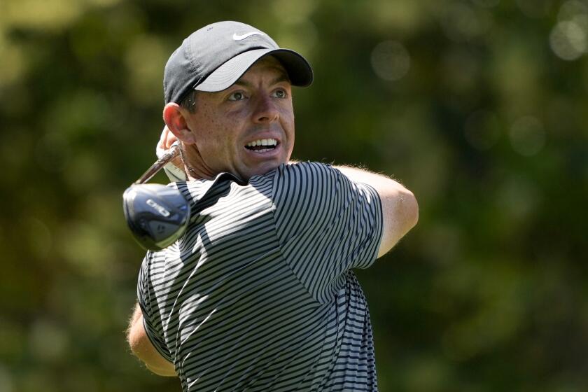 Rory McIlroy, of Northern Ireland, watches his tee shot on the sixth hole during the second round of the RBC Heritage golf tournament, Friday, April 19, 2024, in Hilton Head Island, S.C. (AP Photo/Chris Carlson)