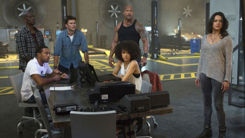 Tyrese Gibson, left, Chris "Ludacris" Bridges, Scott Eastwood, Dwayne Johnson, Nathalie Emmanuel and Michelle Rodriguez in "The Fate of the Furious."