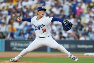 LOS ANGELES, CALIFORNIA - OCTOBER 05: Yoshinobu Yamamoto #18 of the Los Angeles Dodgers.