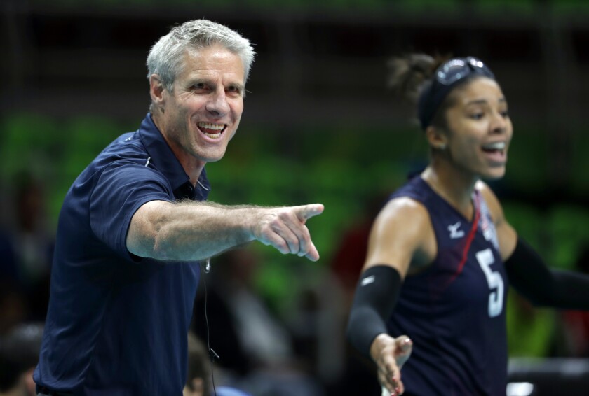 FILE - In this Aug. 20, 2016, file photo, United States head coach Karch Kiraly, left, and Rachael Adams react on the sideline during a women's bronze medal volleyball match against the Netherlands at the Summer Olympics in Rio de Janeiro, Brazil. When the pandemic hit last March leading to a one year postponement of the Olympics and the inability of teams to practice and play together, the U.S. women's volleyball team devised a plan. Unable to work together on serves, sets or spikes, they decided to use that extra time to work on culture, relationships and teamwork. (AP Photo/Jeff Roberson, File)