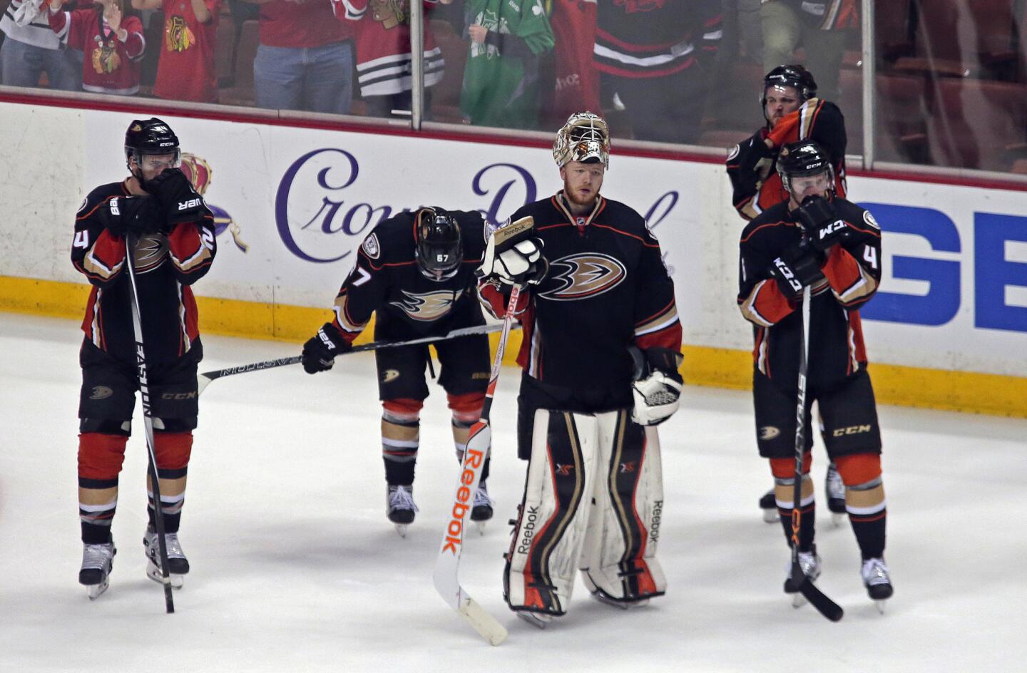 Ducks players, including goalie Frederik Andersen prepare to line up to shake hands with Blackhawks players after losing Game 7, 5-3, on Saturday evening in Anaheim.